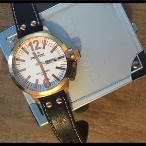 TW Steel rose gold with brown strap watch.